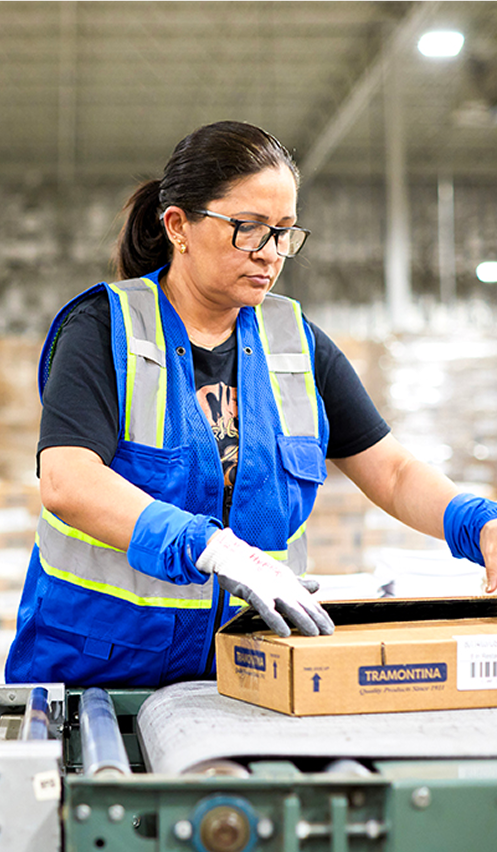 Warehouse worker handling package